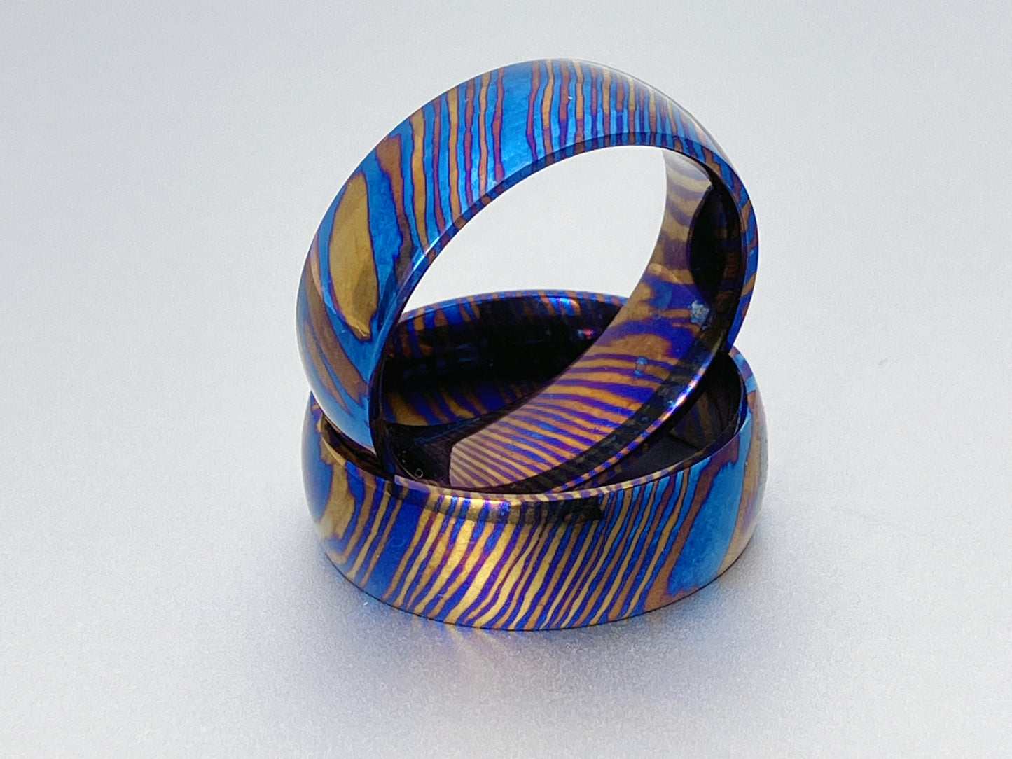 Classic Mokume Ti (Damascus Titanium) ring, three alloys twisted pattern, dome and polish