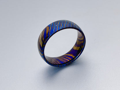 Customized Mokume Ti (TiDamascus) ring, three alloys twisted pattern. ~1weeks, please tell us the size  when you place order