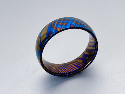 Classic Mokume Ti (Damascus Titanium) ring, three alloys twisted pattern, dome and polish