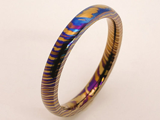 Customized Mokume Ti (TiDamascus) ring, three alloys twisted pattern. ~1weeks, please tell us the size  when you place order